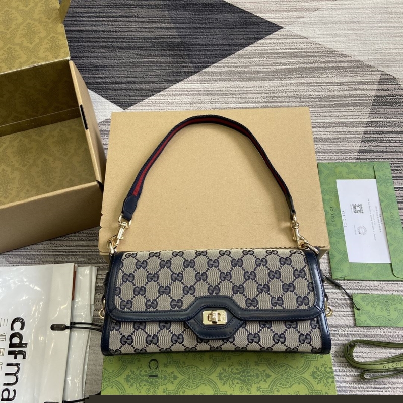 G*u*i top handle bags